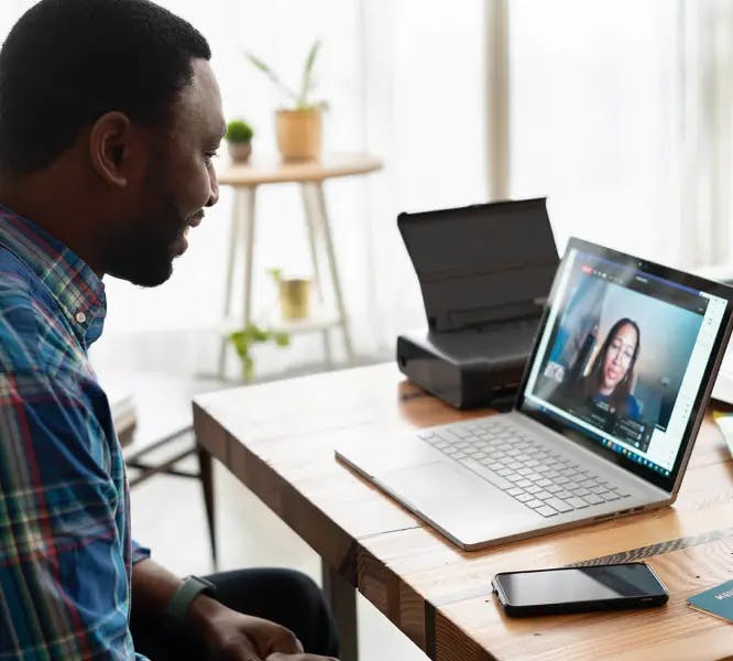 Man speaking on a video call with a woman