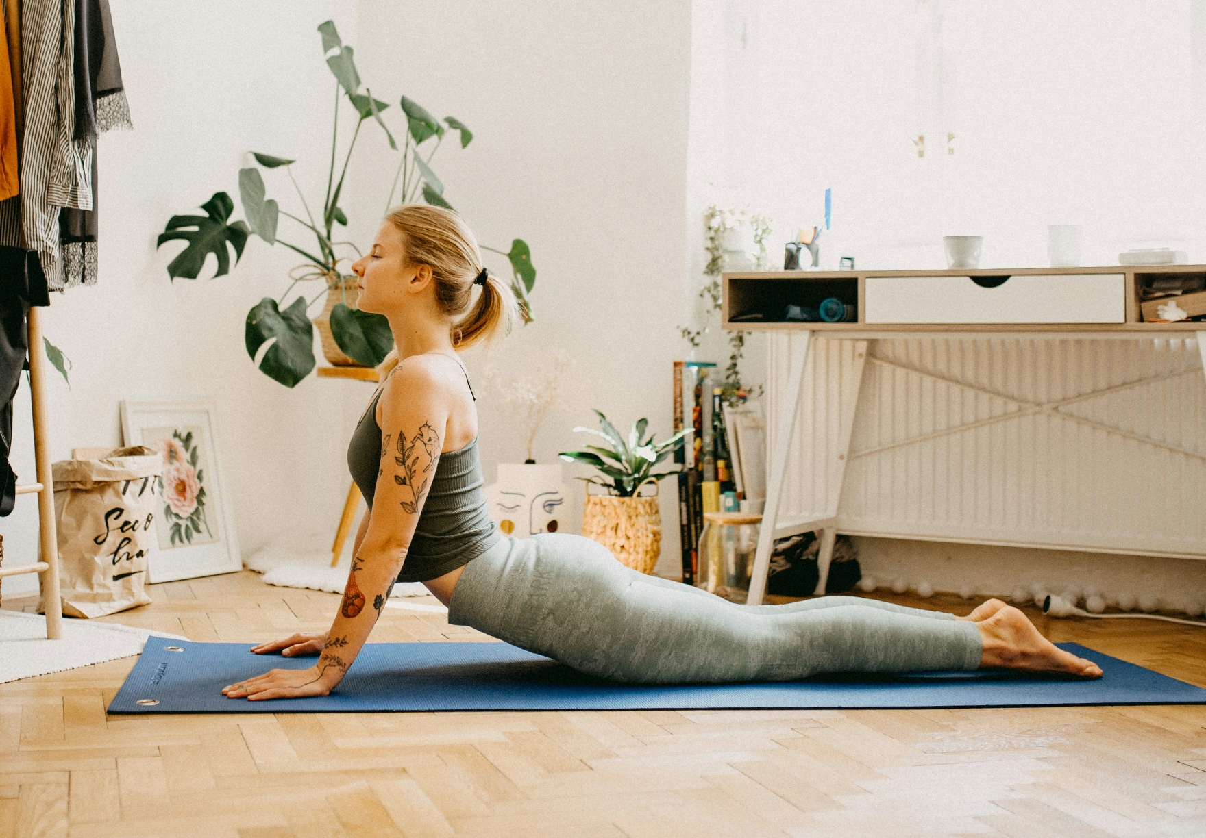 woman doing yoga with plants